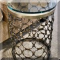 F60. Round metal side table with glass top. 